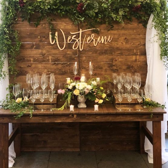 Our wood wall and table used as a Champagne Table Bar